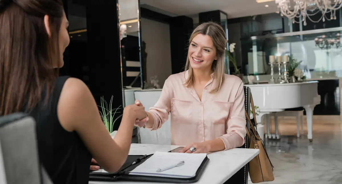Happy hotel team benefiting from AI audits